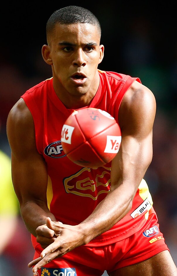 AFL 2016 Rd 21 - Essendon v Gold Coast MELBOURNE, AUSTRALIA - AUGUST 14: Touk Miller of the Suns handpasses the ball during the 2016 AFL Round 21 match between the Essendon Bombers and the Gold Coast Suns at Etihad Stadium on August 14, 2016 in Melbourne, Australia. (Photo by Adam Trafford/AFL Media)